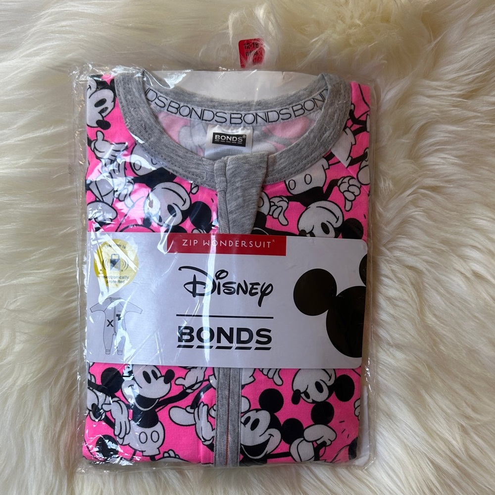 Bonds Pink and Gray Disney Kids One Piece wondersuit. Size 1
